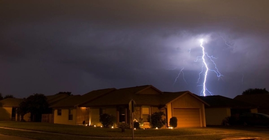 House during a looming thunderstorm